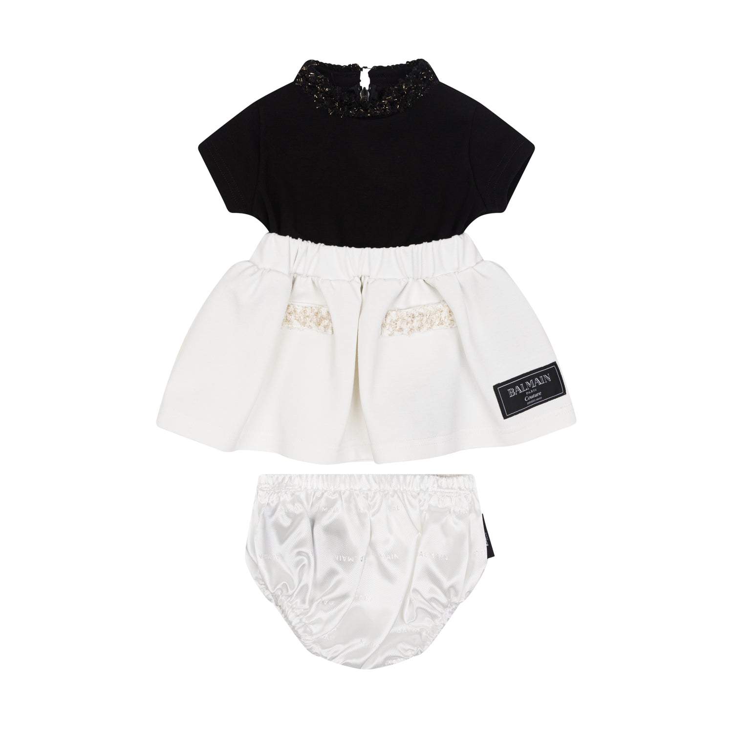 Black top and white skirt with bloomers set on a white background