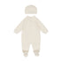 White baby onesie with hat on a white background